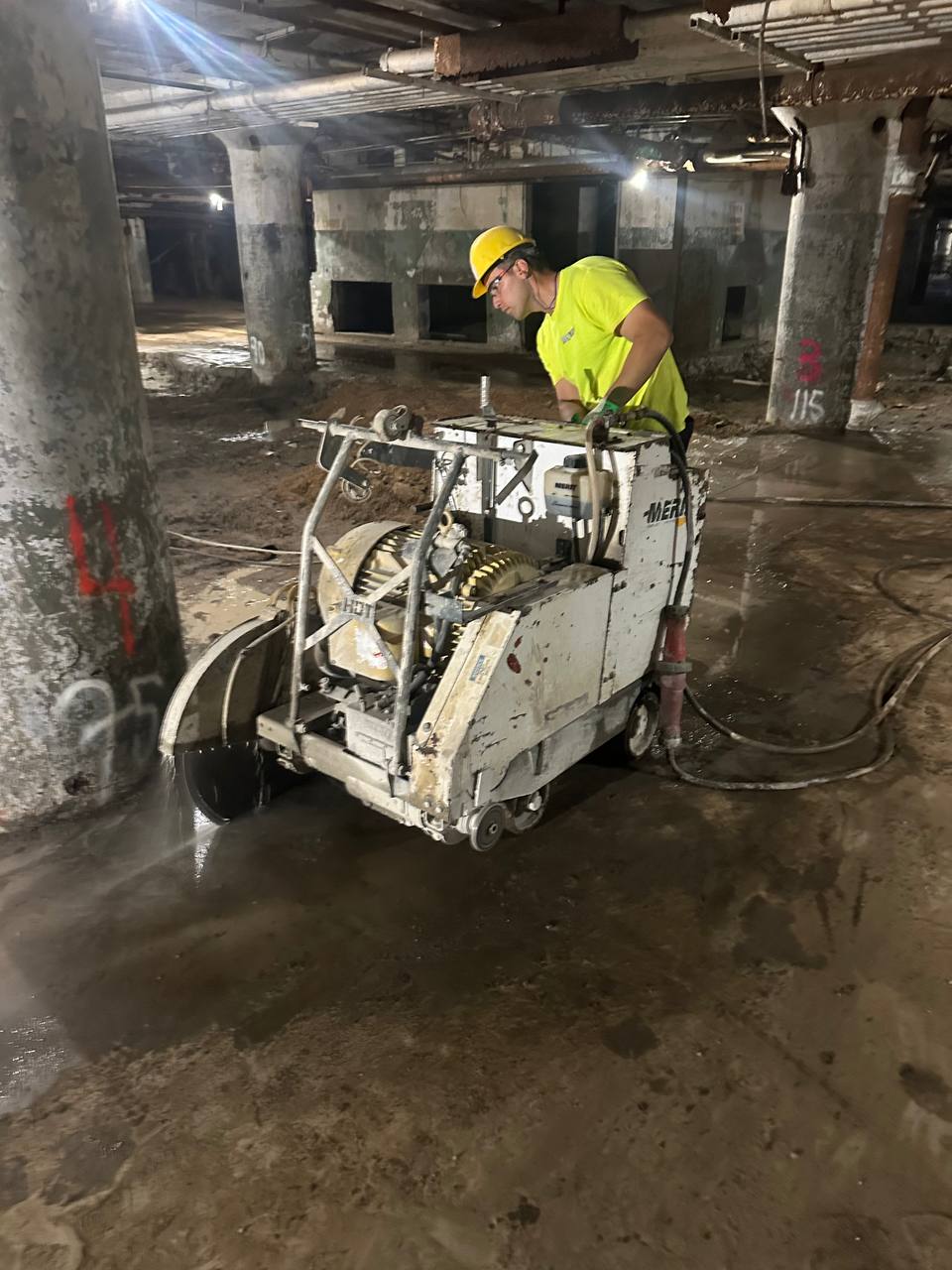 REDCORE operator using industrial flat saw for concrete cutting on commercial project in MA