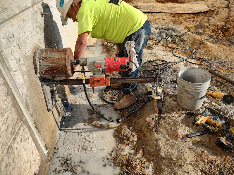 12-inch core drilling in reinforced concrete wall for plumbing penetration